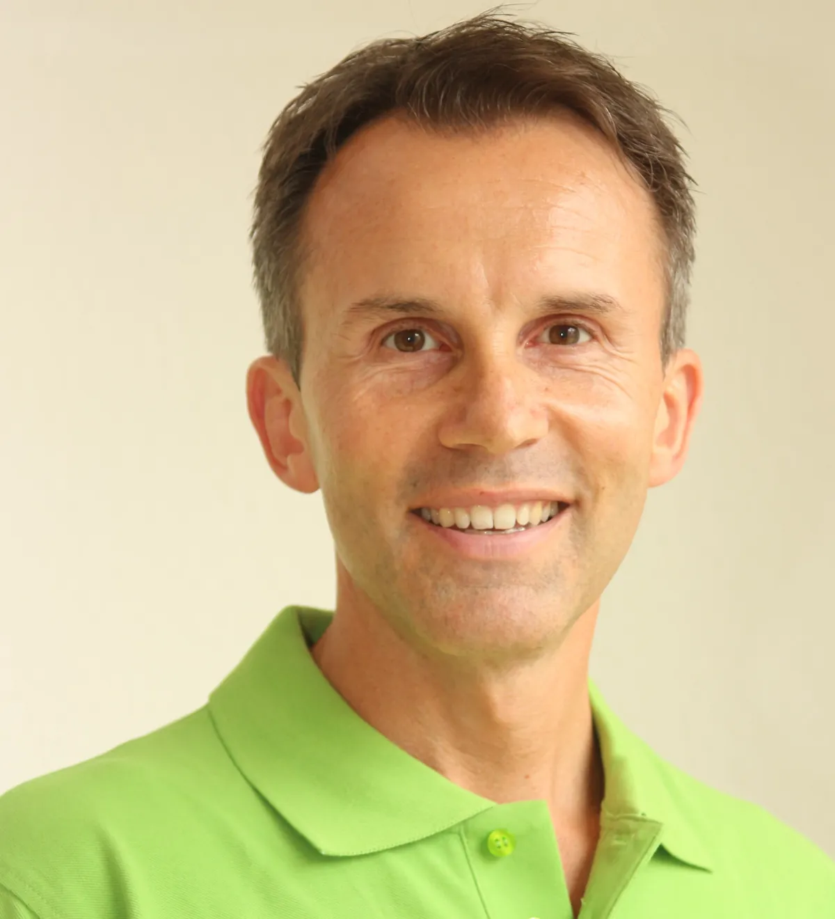 Portrait von Matthias Munz im grünen Poloshirt